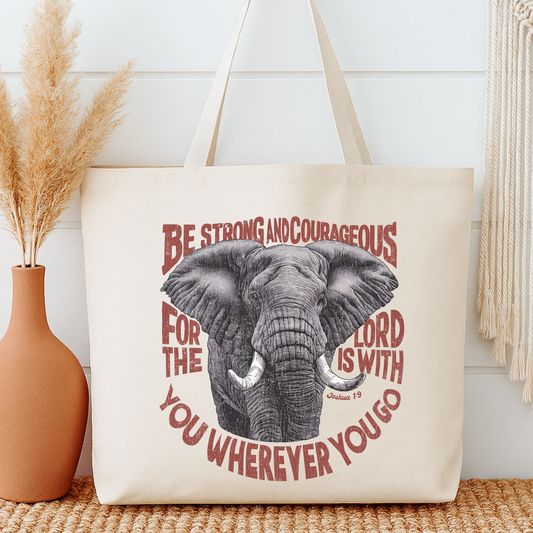 Tote bag with elephant design and bible verse on a neutral background.  Be strong and courageous for the Lord is with you wherever you go.  Joshua 1:9