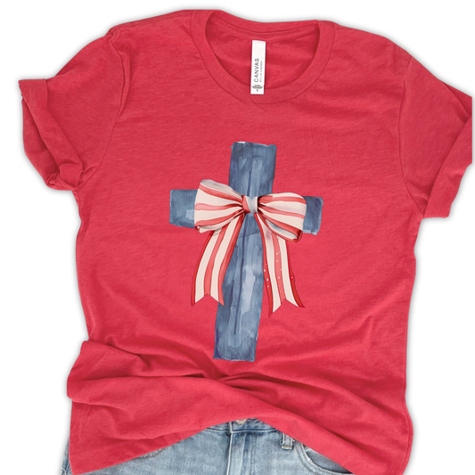 Red t-shirt with a blue cross and red and white bow on a white background
