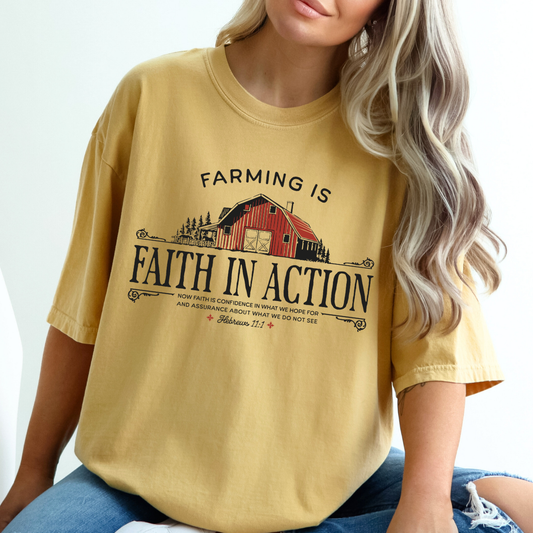 Farming is Faith in Action on a mustard yellow t-shirt with a red barn