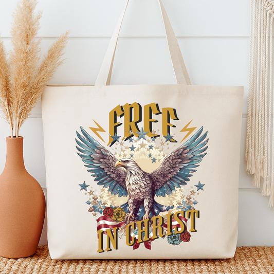 Tote bag with eagle design and 'Free in Christ' text on a neutral background