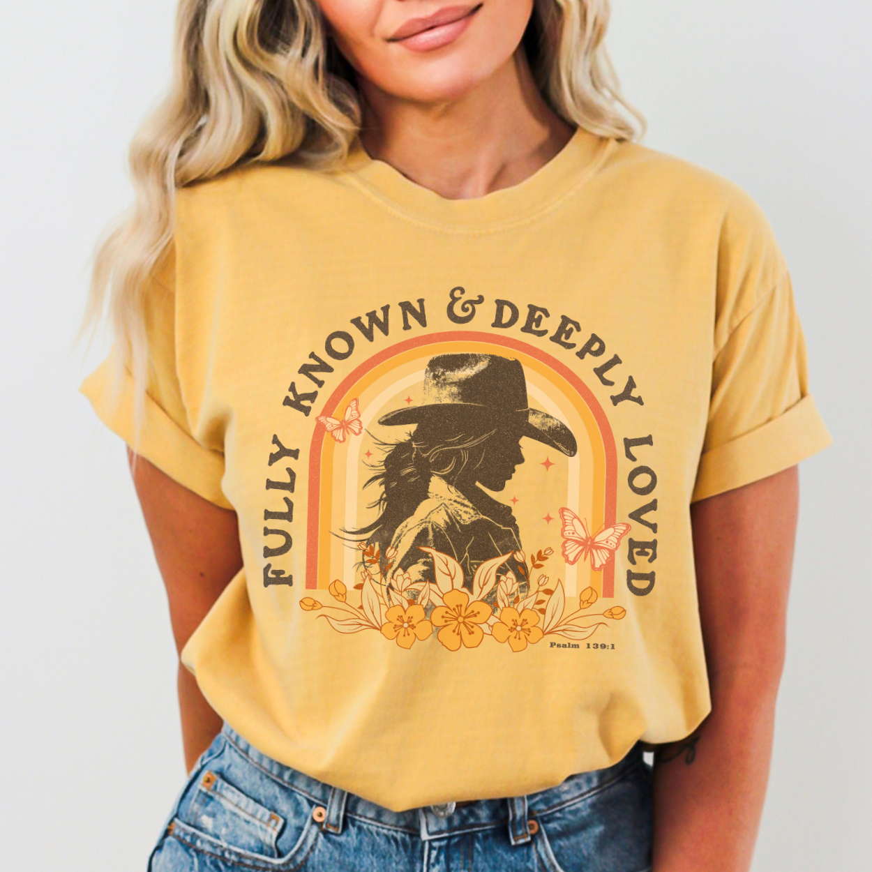 Fully known and deeply loved Christian cowgirl silhouette graphic on yellow shirt