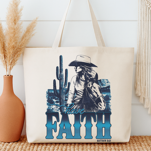Tote bag with a cowboy and cactus design and 'Have Faith' text, placed on a surface with decorative elements.