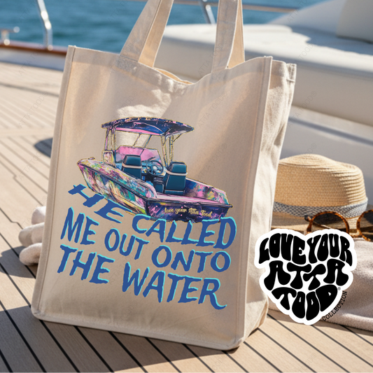 Tote bag with boat graphic and text on a boat deck with ocean view. He called me out onto the water