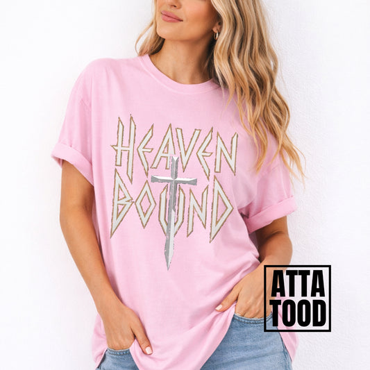 Woman wearing a pink t-shirt with 'Heaven Bound' design and 'ATTA TOOD' branding.