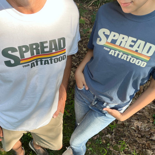 A man wearing a white t-shirt and a woman wearing a blue t-shirt.  comfort colors brand.  The shirt say Spreadyour ATTA TOOD with the t's as crosses