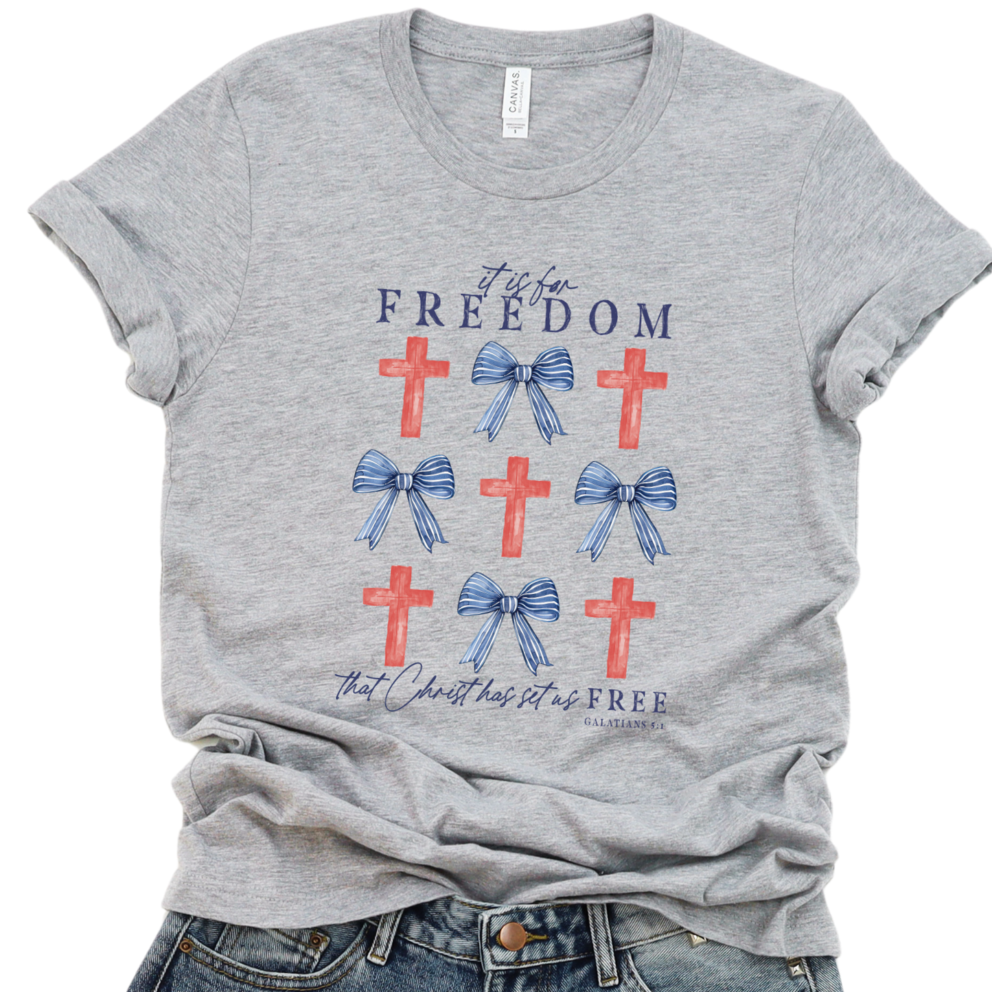Gray t-shirt with red crosses and blue bows on a white background.  It is for Freedom that Christ has set us FREE.