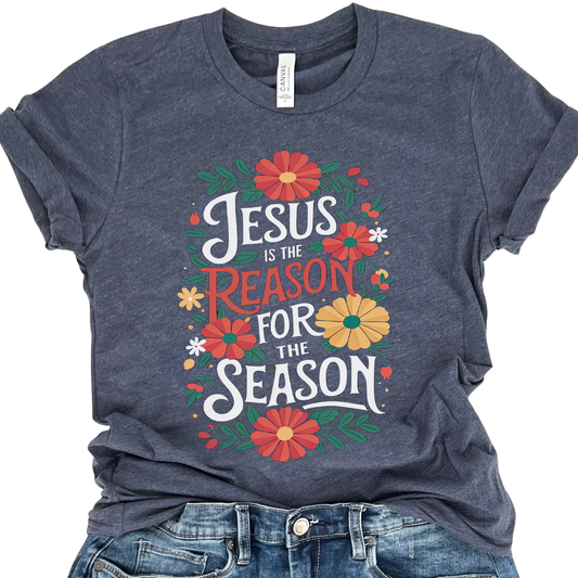 Navy blue t-shirt with 'Jesus is the Reason for the Season' text and floral designs on a white background.