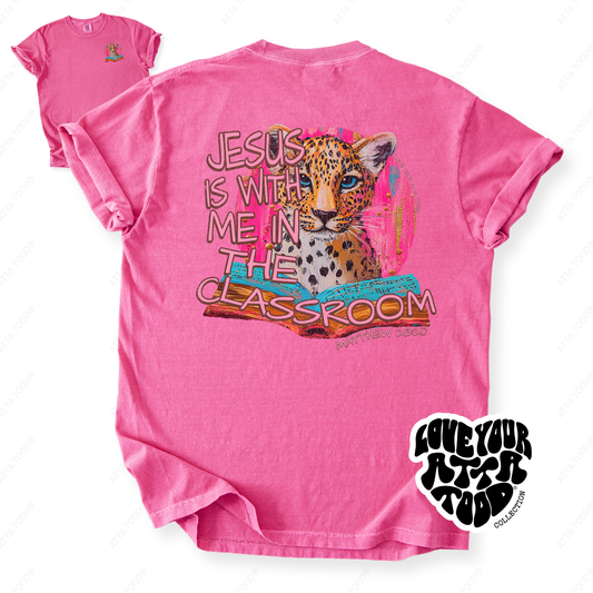 Faith-based teacher graphic with text “Jesus Is With Me in the Classroom,” high-contrast painted style artwork with intentional imperfection, printed on a Comfort Colors® tee.