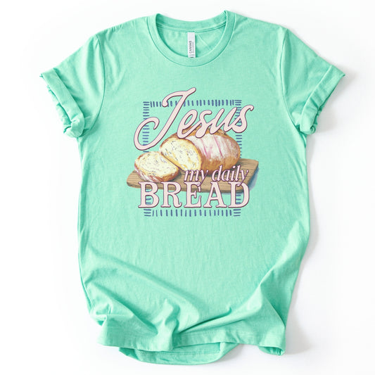 mint "Jesus My Daily Bread" featuring a wood cutting board with a loaf of bread graphic on a premium soft Bella Canvas Unisex tee. 