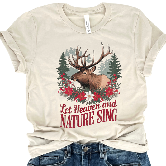 Beige t-shirt with a deer and floral design and text 'Let Heaven and Nature Sing' on a white background.