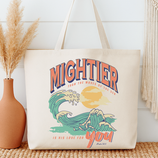 Tote bag with 'Mightier than the waves of the sea is His love for you' design on a neutral background
