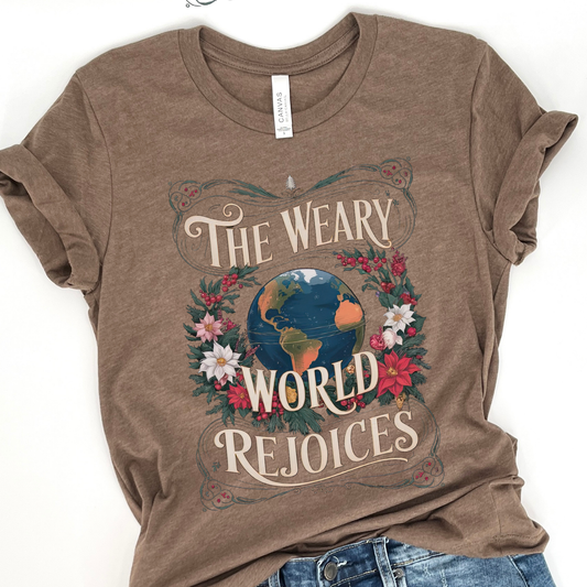 Brown t-shirt with 'The Weary World Rejoices' graphic design on a white background