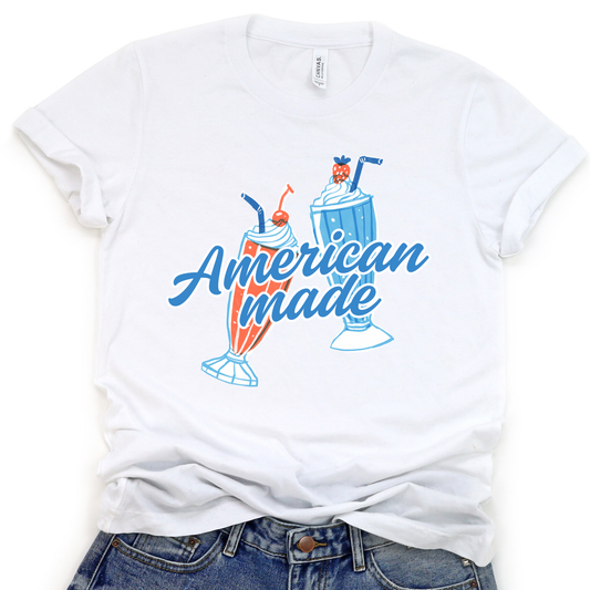 A white graphic t-shirt with 'American made' text and a Fourth of July theme, featuring a red and blue color scheme.  Feature two milkshakes