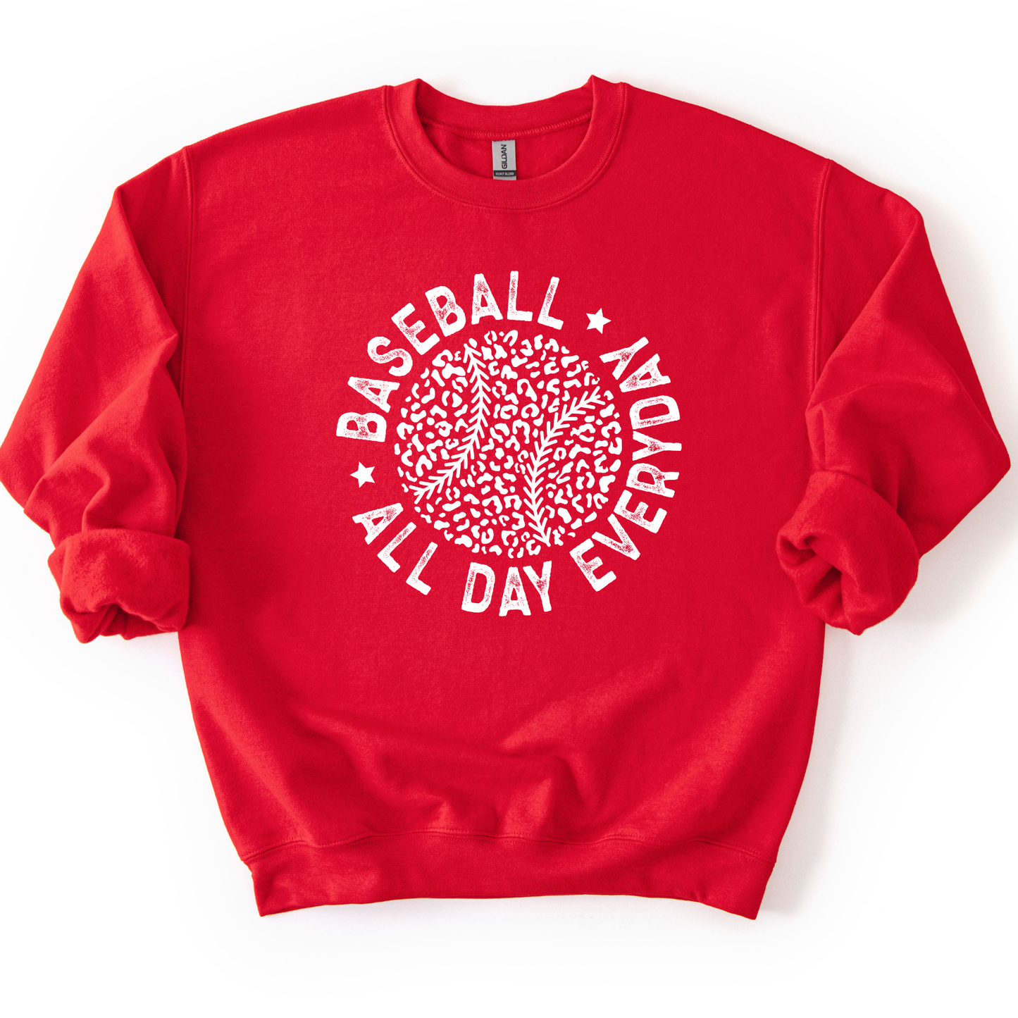 red crewneck sweatshirt featuring a black circular graphic with a leopard print baseball and curved text reading “Baseball All Day Everyday,” styled flat with sleeves scrunched on a white background.