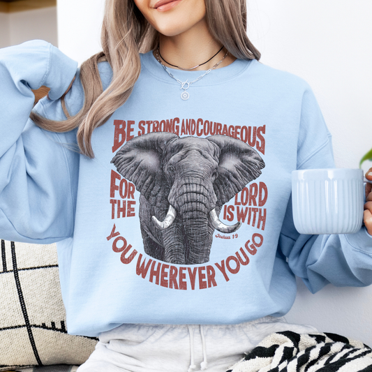 Be Strong and courageous for the Lord is with you where ever you go on a blue sweatshirt.  Picture of a large elephant