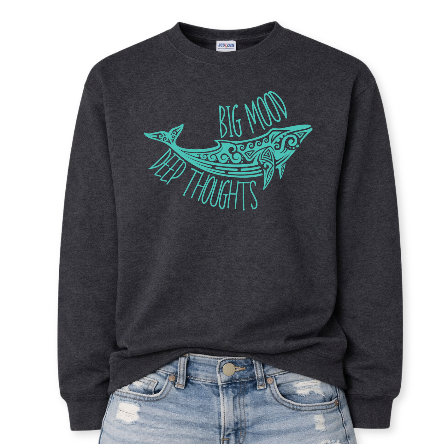 Heather black Coastal ocean themed graphic on a heather black classic crewneck sweatshirt. The design features a large decorative whale illustration filled with detailed swirl and sea life pattern elements. The phrase Big Mood Deep Thoughts is incorporated into the artwork with curved lettering that follows the whale shape, creating a balanced ocean inspired layout.