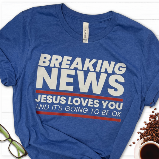 Breaking News! Jesus Loves you royal blue tee