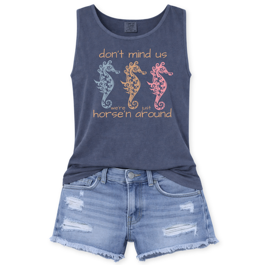 Don't Mind Us We're Just Horse'n around ocean seahorse graphic on a denim Comfort Colors garment dyed unisex tank top.