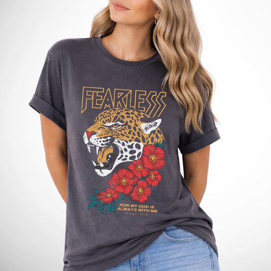 Woman wearing a dark gray t-shirt with a leopard graphic and 'FEARLESS' text on a white background. Fearless for my God is always with me Isaiah 41:10