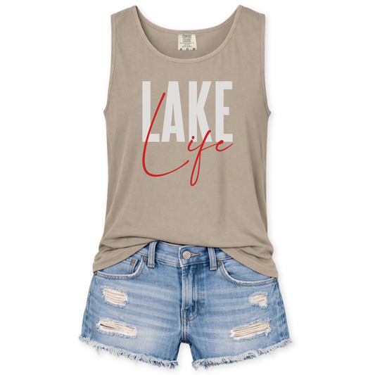 Beige tank top with 'Lake Life' text and denim shorts on a white background