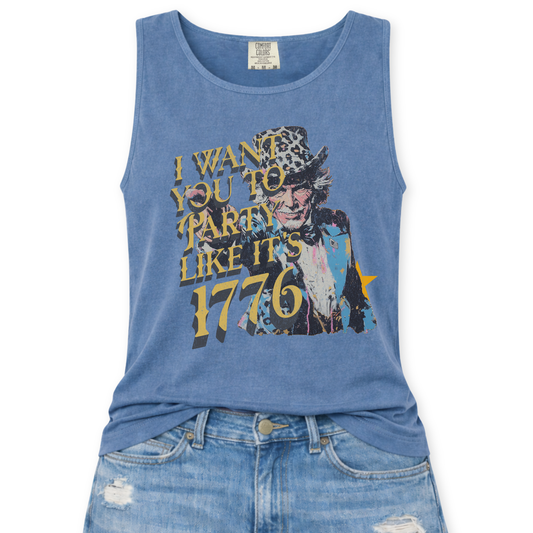 Comfort Colors tank top featuring a distressed vintage Uncle Sam graphic with the phrase “I Want You To Party Like It’s 1776” in layered gold and dark lettering, styled in a flat lay mockup with light wash denim jeans.