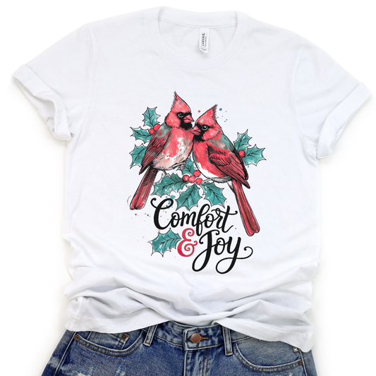 White t-shirt with red cardinals and 'Comfort & Joy' text on a white background