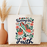 Tote bag with 'Running on Faith' design featuring shoes and flowers, placed against a white wall.