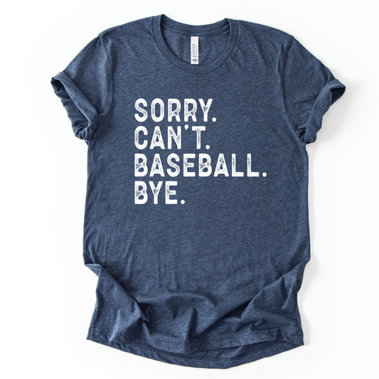 Blue t-shirt with white text 'Sorry. Can't. Baseball. Bye.' on a white background