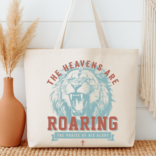 Tote bag with lion graphic and text 'The Heavens are Roaring' n