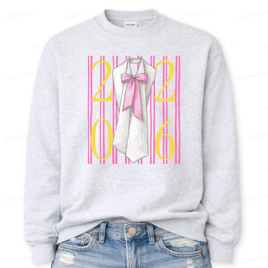 Graduation 2026 graphic on a classic ash crewneck sweatshirt. The design features bold 2026 numerals layered over vertical pink stripe accents, centered with a detailed sash illustration finished with an oversized pink bow. The feminine bow detail combined with strong year callout creates a standout Class of 2026 statement that works for both high school seniors and college graduates.