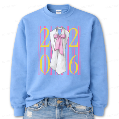 Graduation 2026 graphic on a classic Columbia Blue crewneck sweatshirt. The design features bold 2026 numerals layered over vertical pink stripe accents, centered with a detailed sash illustration finished with an oversized pink bow. The feminine bow detail combined with strong year callout creates a standout Class of 2026 statement that works for both high school seniors and college graduates.