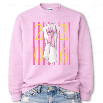 Graduation 2026 graphic on a classic pink crewneck sweatshirt. The design features bold 2026 numerals layered over vertical pink stripe accents, centered with a detailed sash illustration finished with an oversized pink bow. The feminine bow detail combined with strong year callout creates a standout Class of 2026 statement that works for both high school seniors and college graduates.