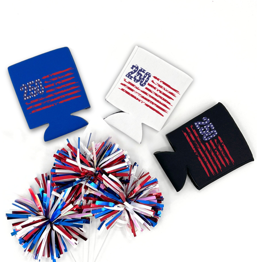 White, Blue and Black collapsible can cooler displayed on a white background with a red, white, and blue metallic pom pom in the foreground. The graphic features the number “250” filled with an American flag pattern next to distressed red flag stripes, celebrating America’s 250th anniversary. Patriotic graphic printed on the front of the drink sleeve style can cooler.
