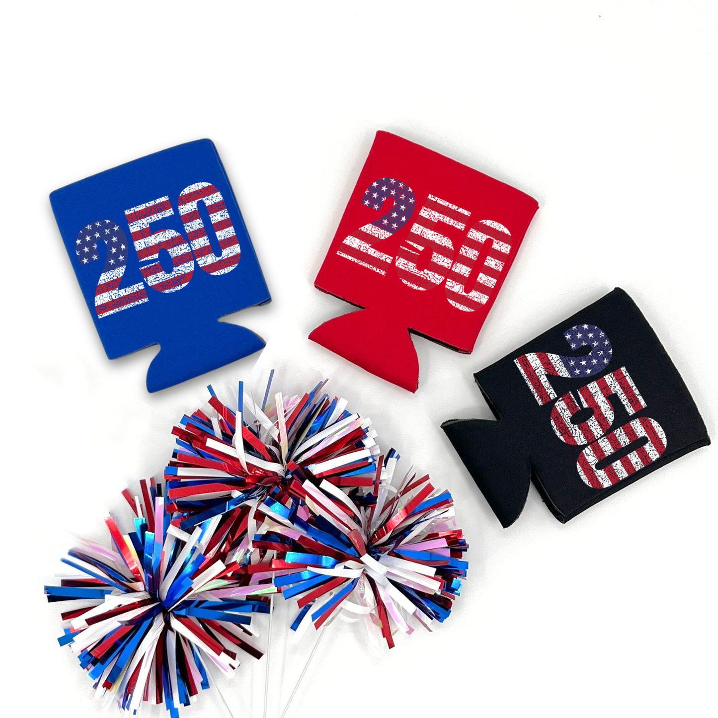 Red, Blue and Black collapsible can cooler displayed on a white background with a red, white, and blue metallic pom pom in the foreground. The graphic features the number “250” filled with a distressed American flag pattern celebrating America’s 250th anniversary. Patriotic graphic printed on the front of the drink sleeve style can cooler.
