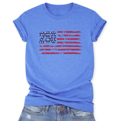 Heather Carolina Blue Bella Canvas t-shirt mockup with rolled sleeves and a front tuck into distressed denim, featuring a small “250” with stars and distressed red flag stripes graphic across the chest.