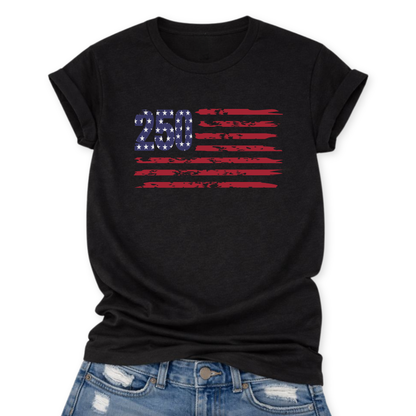 Solid Black Blend Bella Canvas t-shirt mockup with rolled sleeves and a front tuck into distressed denim, featuring a small “250” with stars and distressed red flag stripes graphic across the chest.