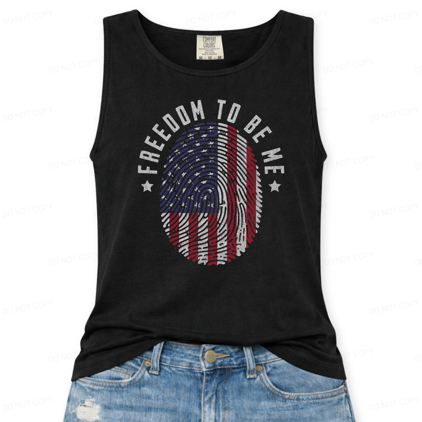 Black tank top with 'Freedom to be Me' and American flag design, worn with blue jeans on a white background.