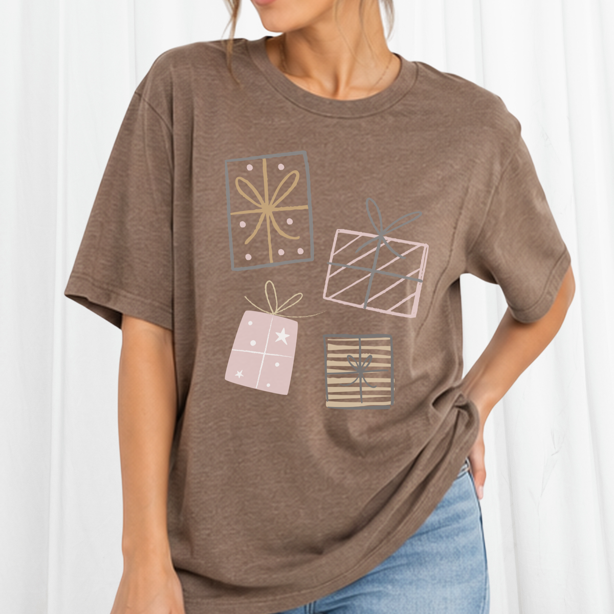 4 Christmas presents on a bella canvas brown tee