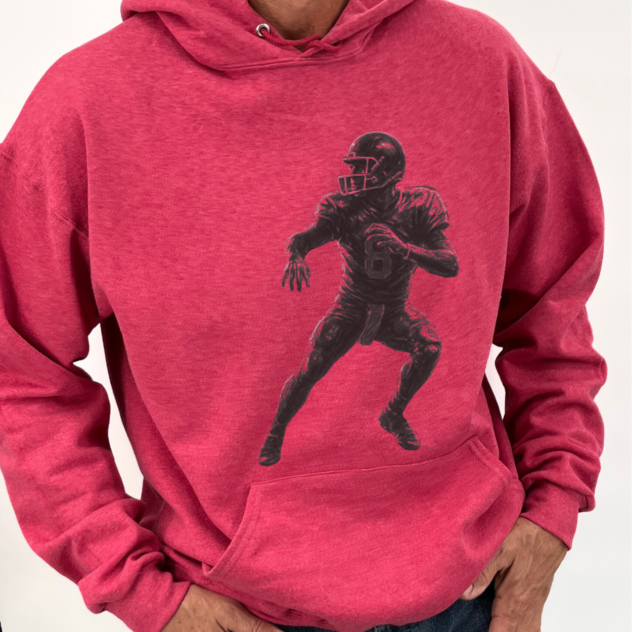Red hoodie with a black silhouette of a football player on a white background