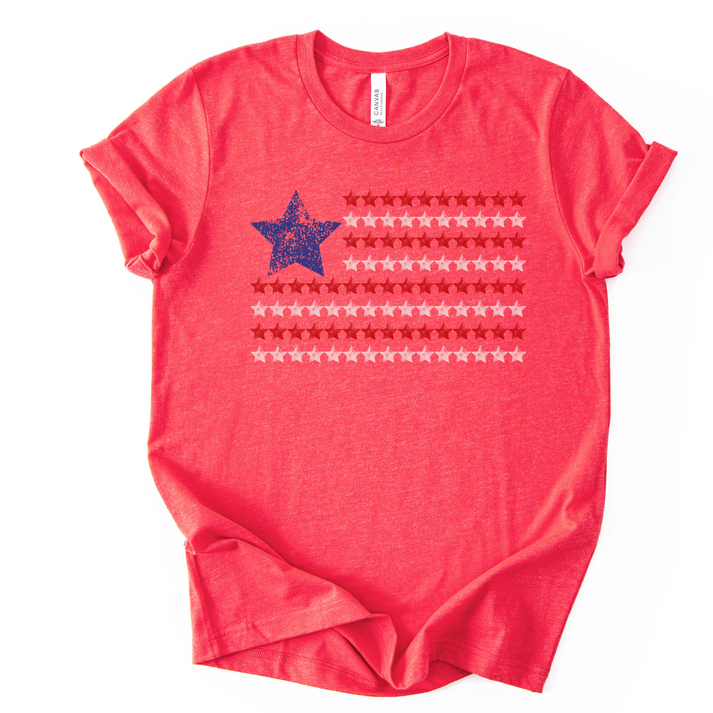 Patriotic Americana flag graphic on a red t-shirt. The design features a distressed blue star positioned at the top left, paired with horizontal rows of red stars forming a flag-inspired layout. Soft weathered textures give the graphic a vintage, worn-in look while keeping the overall style clean and modern. The simple star-based flag design makes this an easy, everyday patriotic piece for Fourth of July, summer holidays, and Americana-themed collections.