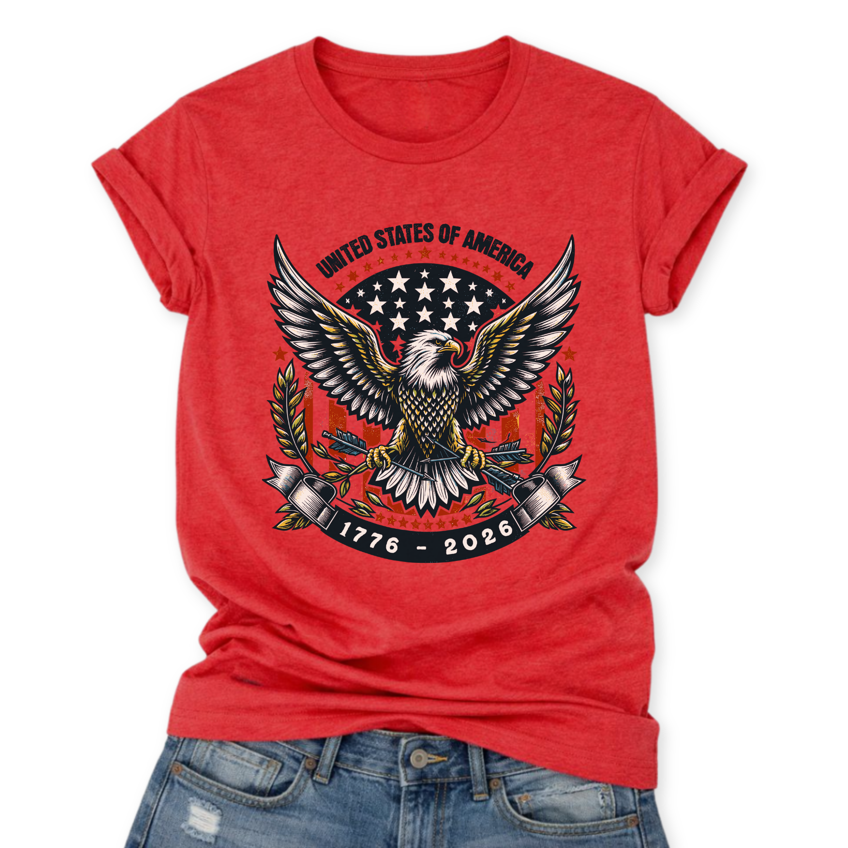 Flat-lay graphic on Bella Canvas Heather Red t-shirt featuring a bold USA eagle emblem with spread wings, star badge, laurel branches, and “United States of America” with “1776–2026” banner.
