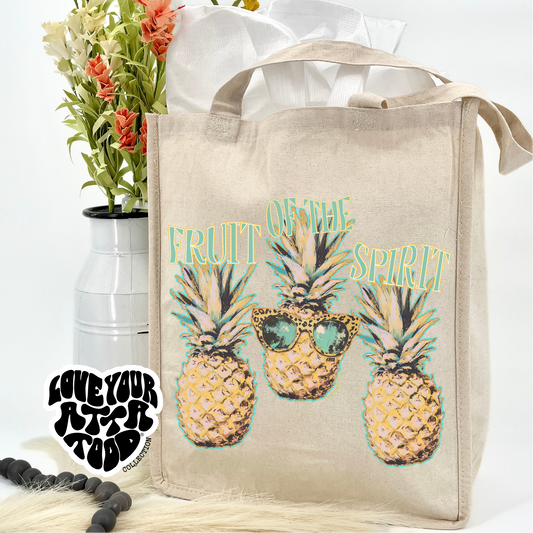 Fruit of the spirit jumbo canvas tote bag featuring 3 colorful pineapples wearing sunglasses