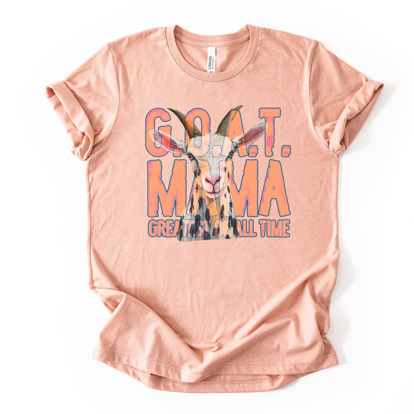 heather peach "G.O.A.T Greatest of All Time Mama" Featuring a goat graphic tee on a premium soft Bella Canvas Unisex tee.&nbsp;