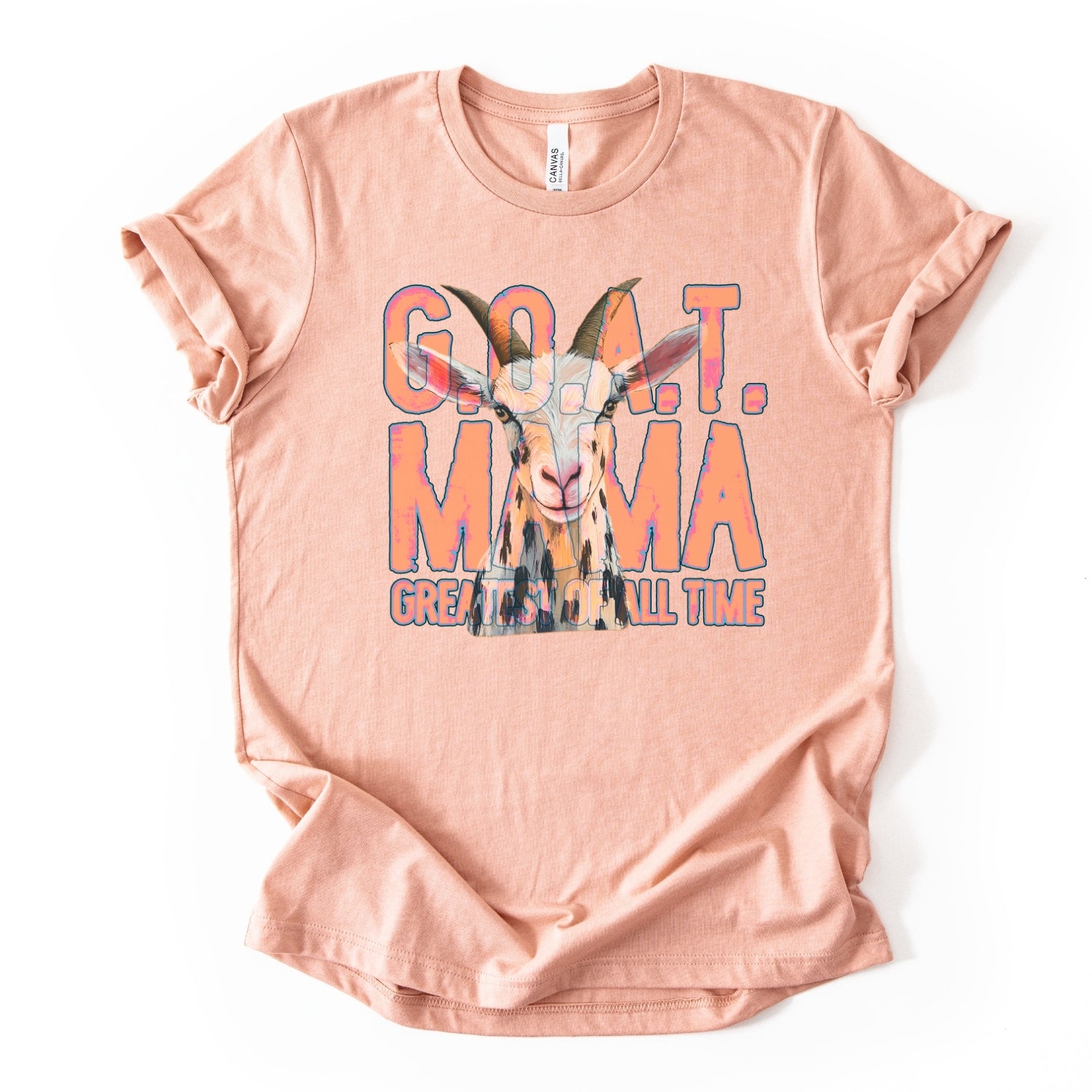 heather peach "G.O.A.T Greatest of All Time Mama" Featuring a goat graphic tee on a premium soft Bella Canvas Unisex tee.&nbsp;