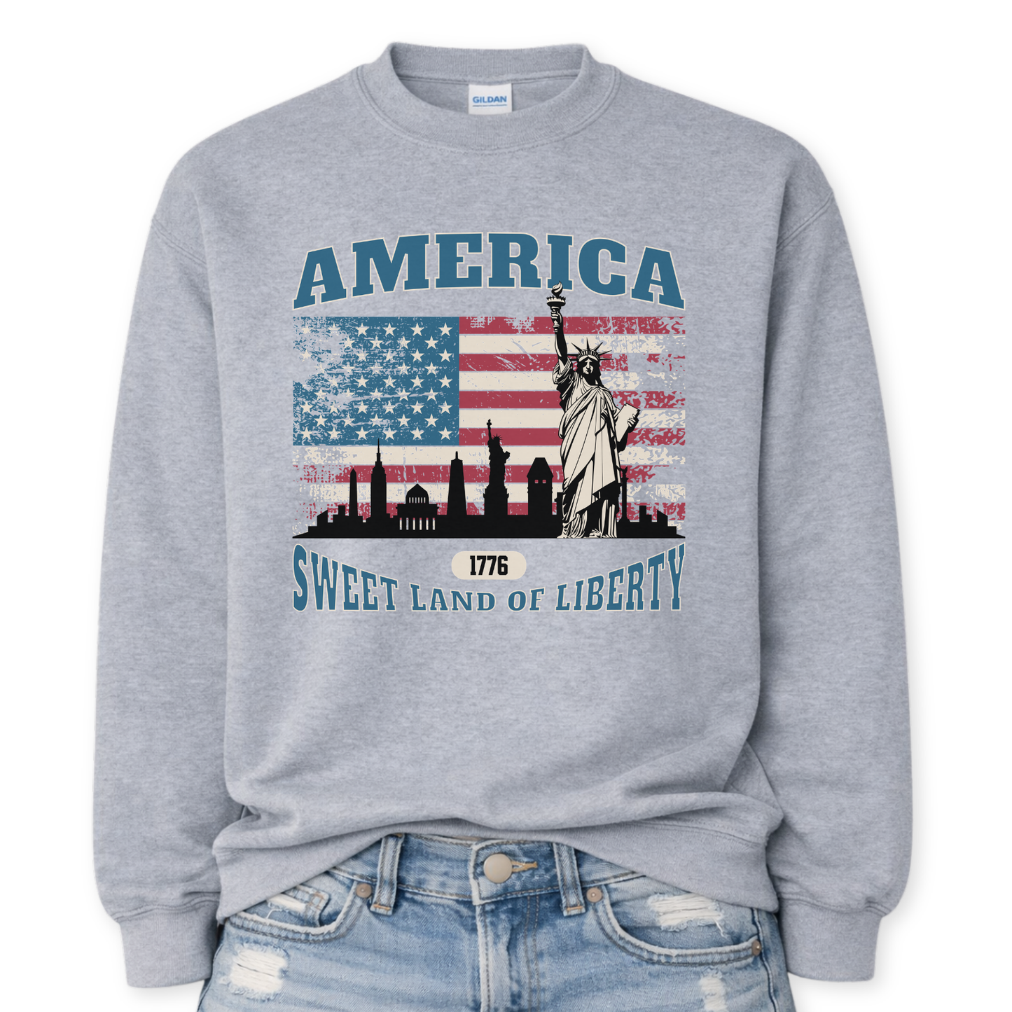 sport gray gray sweatshirt with American flag and Statue of Liberty design on a white background.  America, 1776 Sweet Land Of Liberty saying