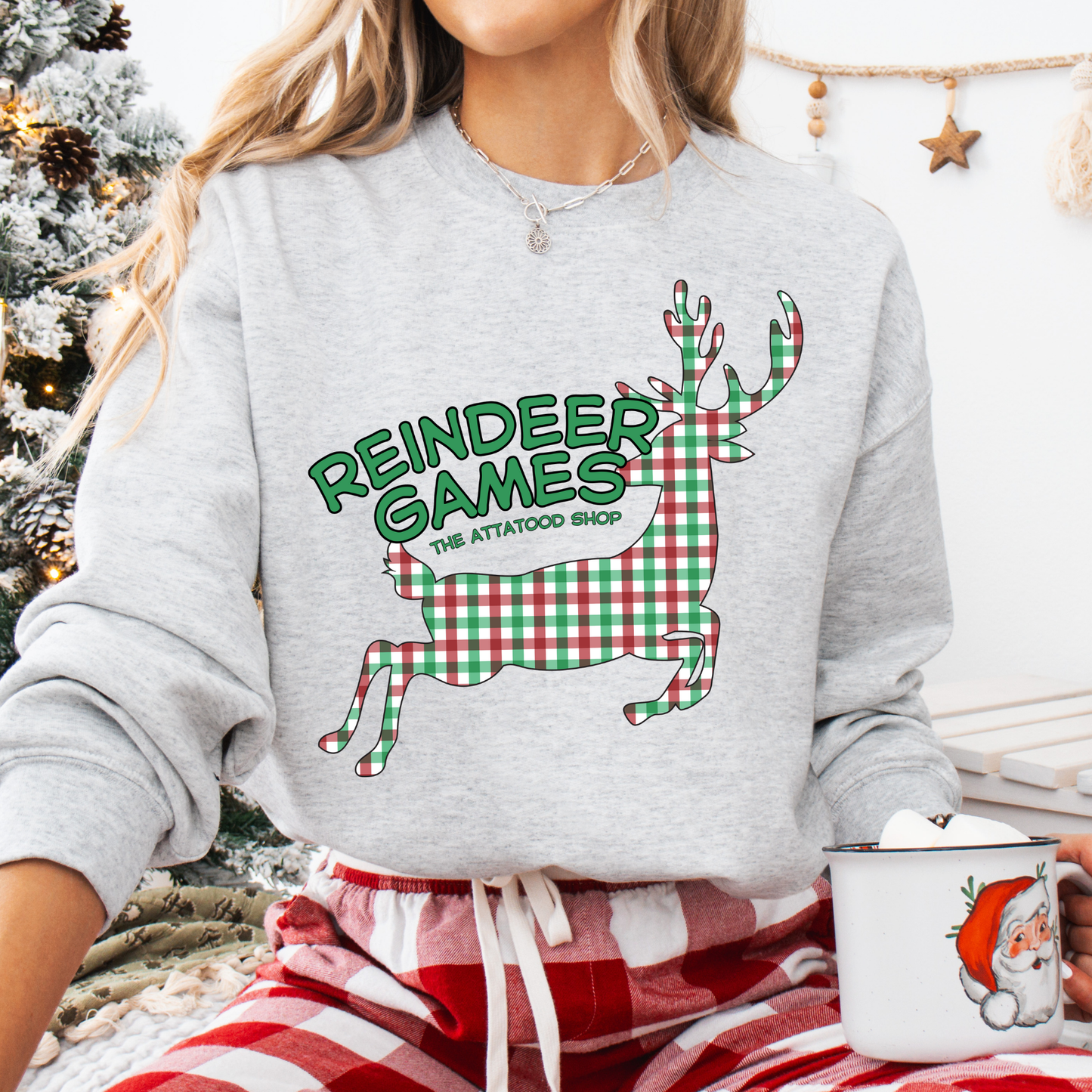 gray sweatshirt with a plaid reindeer.  Test says reindeer games.  You can customize the sweatshirt with business name, town and state or both