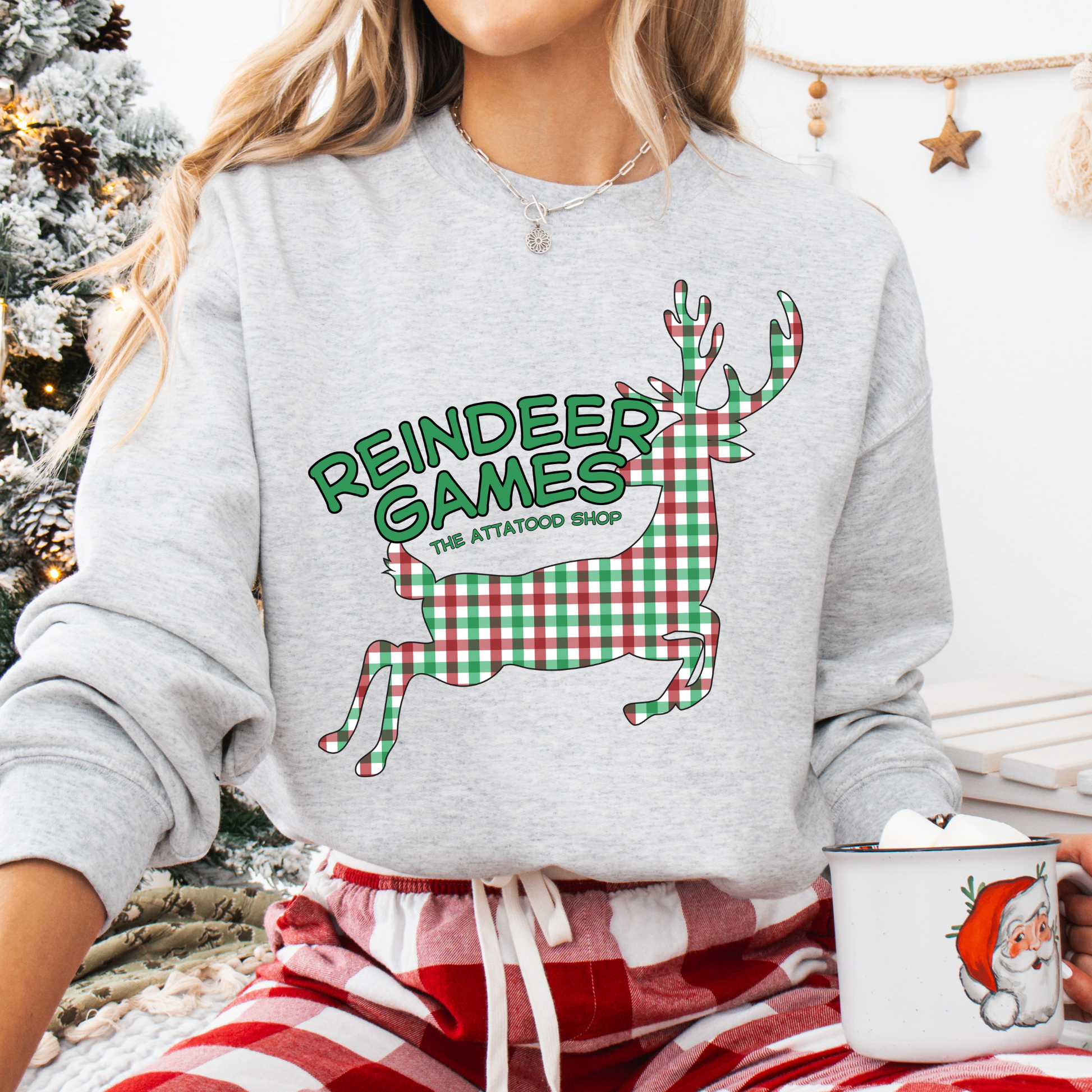 gray sweatshirt with a plaid reindeer.  Test says reindeer games.  You can customize the sweatshirt with business name, town and state or both