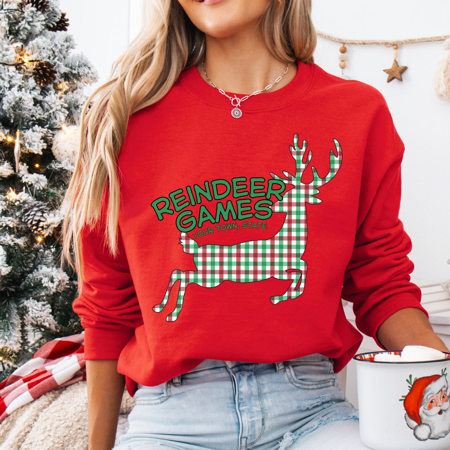 red sweatshirt with a plaid reindeer.  Test says reindeer games.  You can customize the sweatshirt with business name, town and state or both