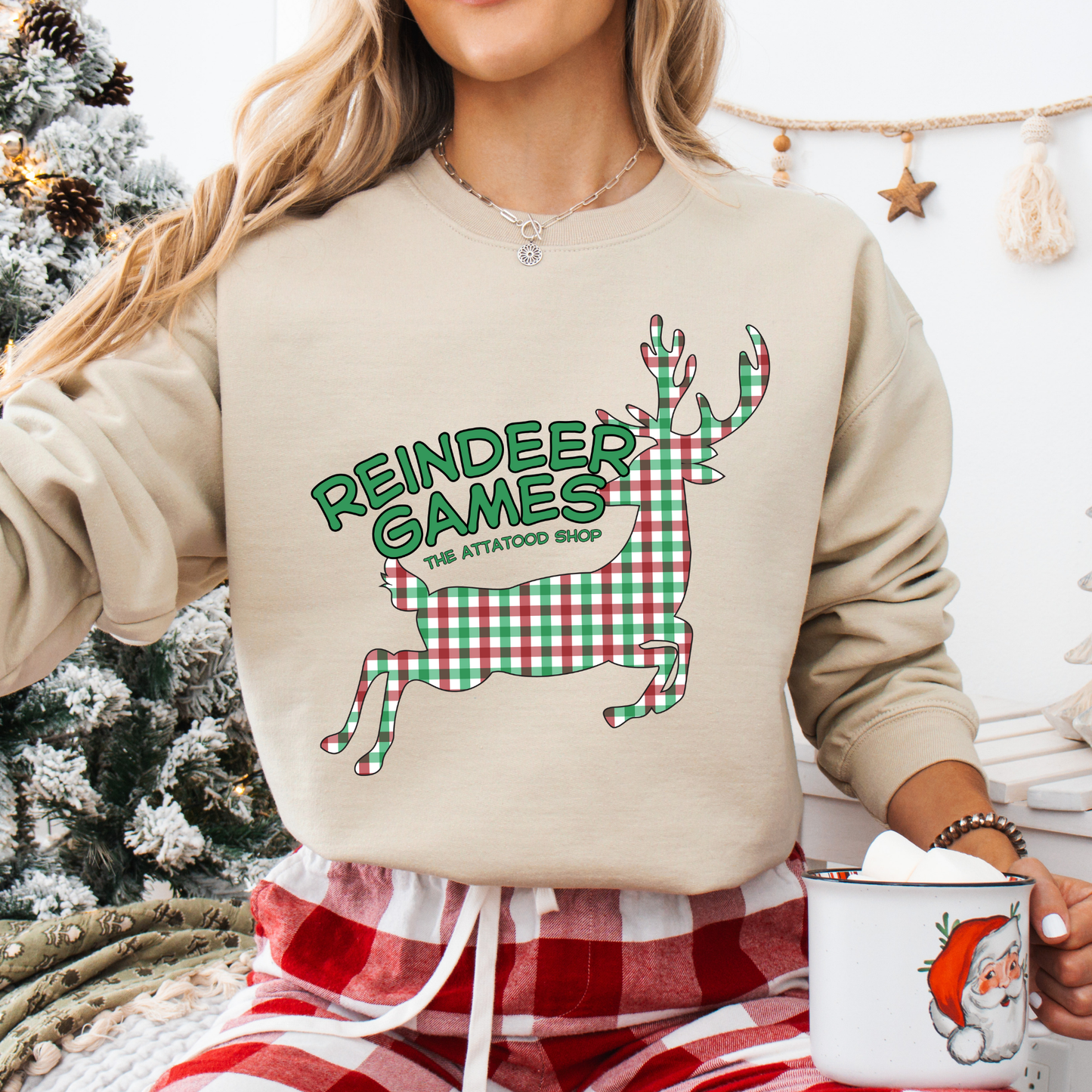 beige sweatshirt with a plaid reindeer.  Test says reindeer games.  You can customize the sweatshirt with business name, town and state or both