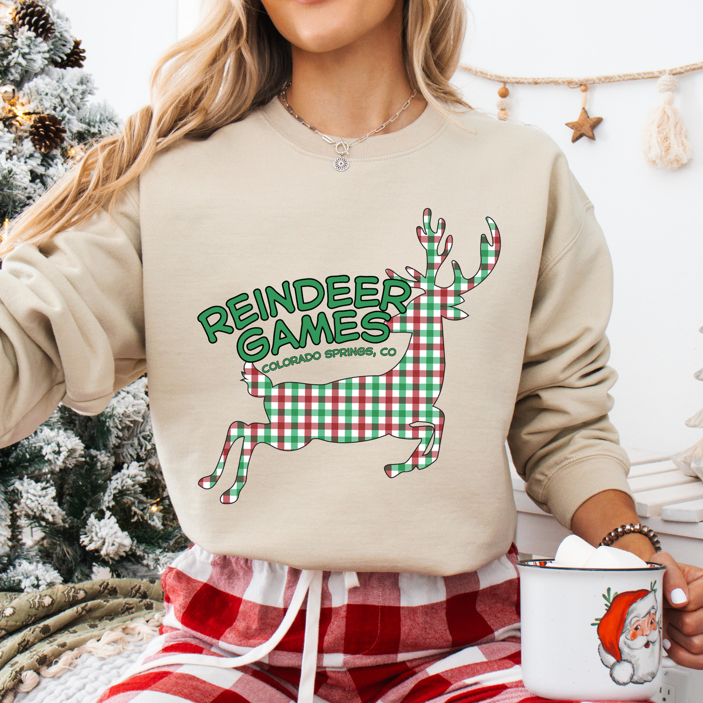 beige sweatshirt with a plaid reindeer.  Test says reindeer games.  You can customize the sweatshirt with business name, town and state or both